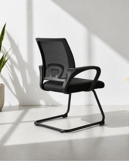 Angled view of Blaze fixed visitor chair showing mesh backrest, cushioned seat and MS cantilever base – Kazuri Store
