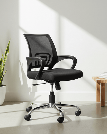 Front view of black mid-back ergonomic office revolving chair with cushioned seat and nylon swivel base with castors – Blaze MB by Kazuri