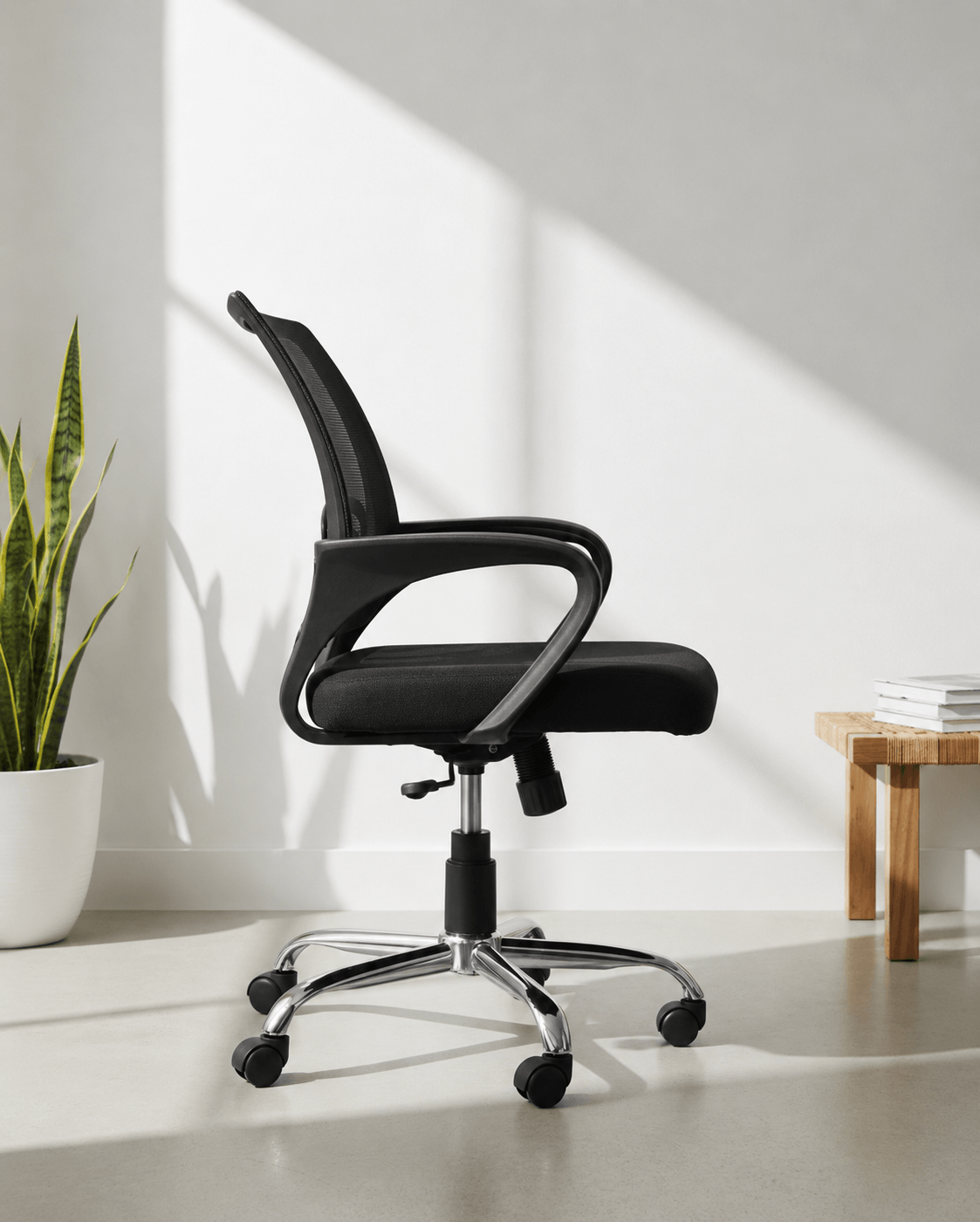 Side view of Blaze MB mid-back ergonomic office revolving chair showing cushioned seat and gas lift base – Kazuri Store