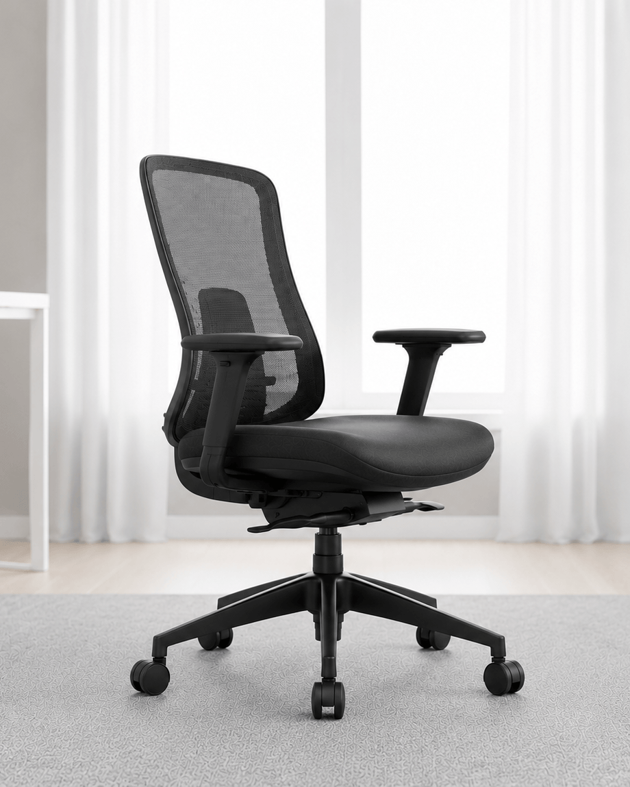 Side view of black mid-back ergonomic revolving office chair with moulded foam seat, adjustable armrests and hydraulic gas lift base – Fedo MB by Kazuri