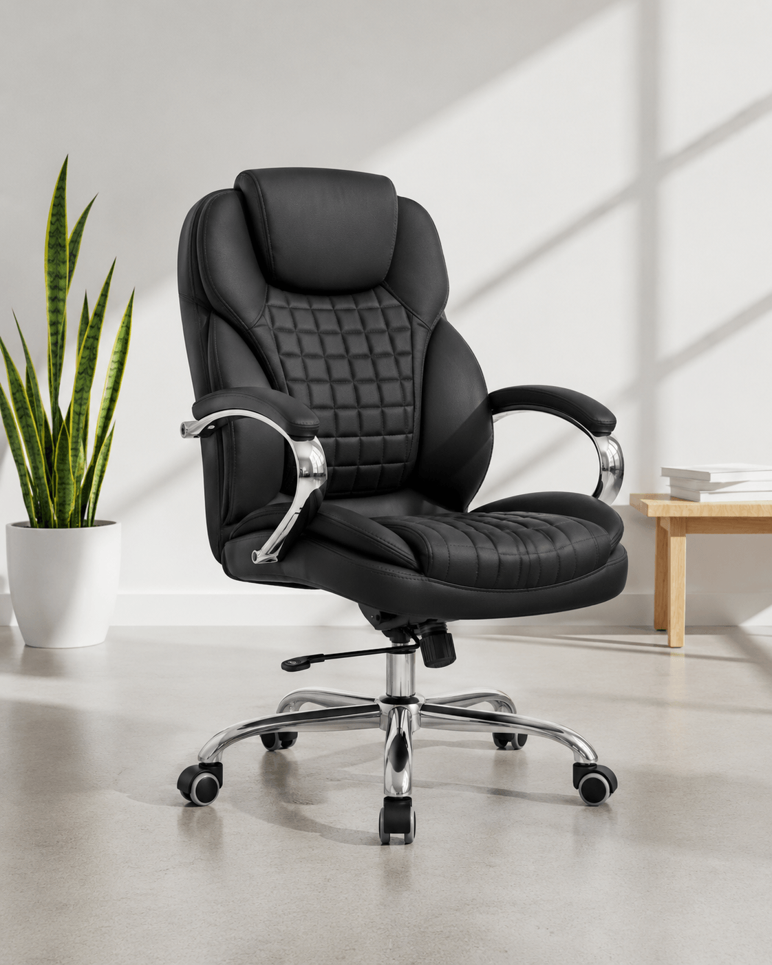Front view of black mid-back executive cushioned revolving office chair with quilted back, integrated headrest, padded chrome armrests and chrome five-star base – Galaxy by Kazuri