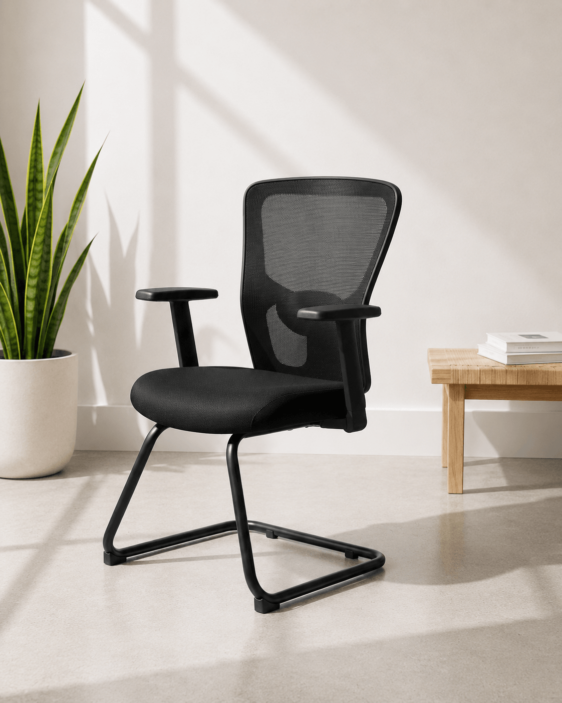 Front view of black fixed visitor chair with breathable mesh back, cushioned seat, fixed armrests and MS cantilever base – Jazz by Kazuri
