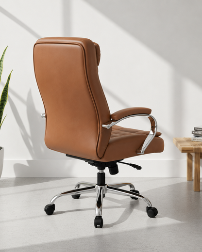 Rear view of Brown high-back executive cushioned revolving office chair with leather-look upholstery, padded chrome armrests and chrome five-star swivel base – Kelly by Kazuri