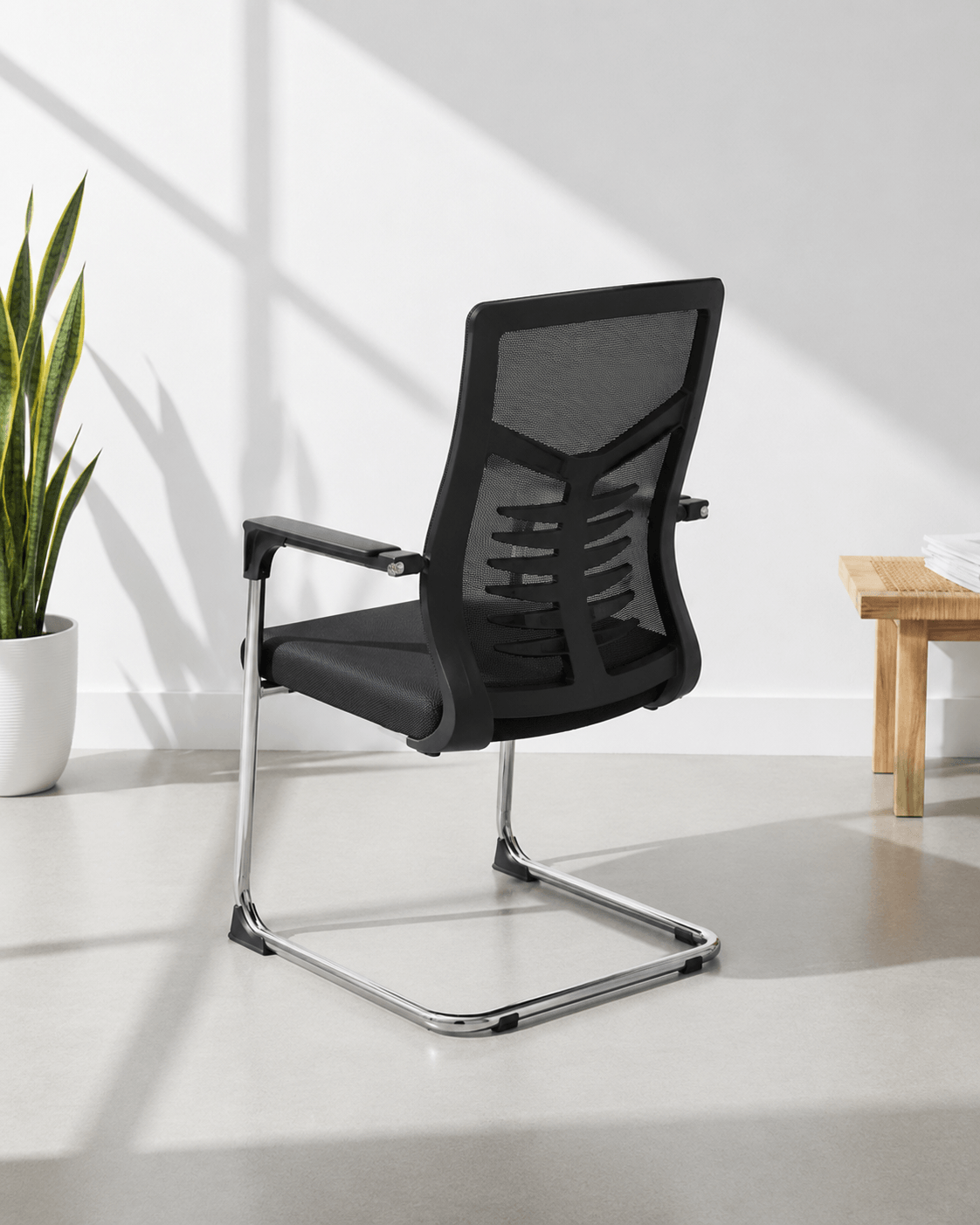 Back view of SM 723 fixed visitor chair showing moulded foam seat and chrome fixed base – Kazuri Store