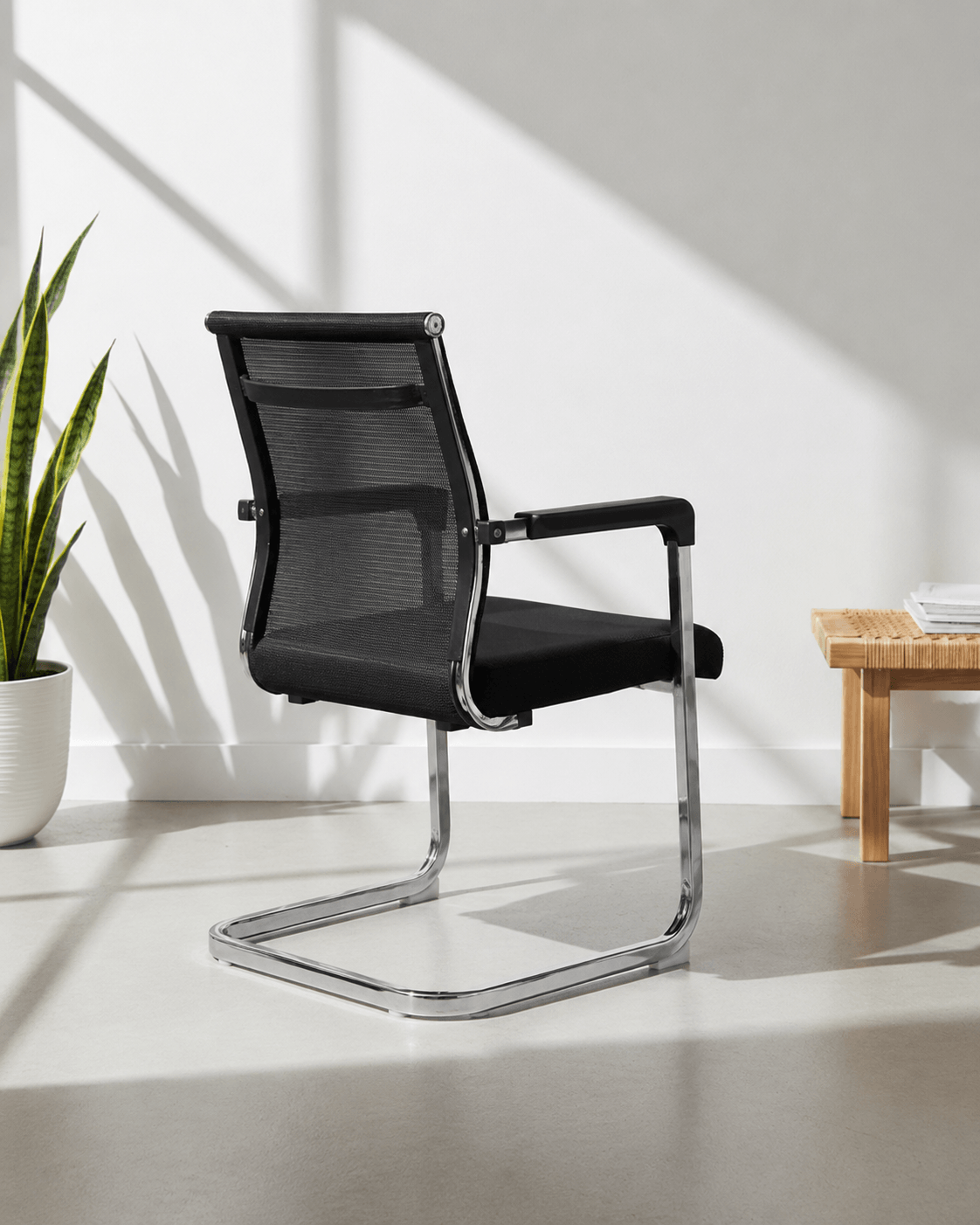 Rear view of SM 724 fixed visitor chair showing moulded foam back and chrome fixed base – Kazuri Store