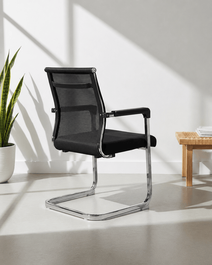 Rear view of SM 724 fixed visitor chair showing moulded foam back and chrome fixed base – Kazuri Store