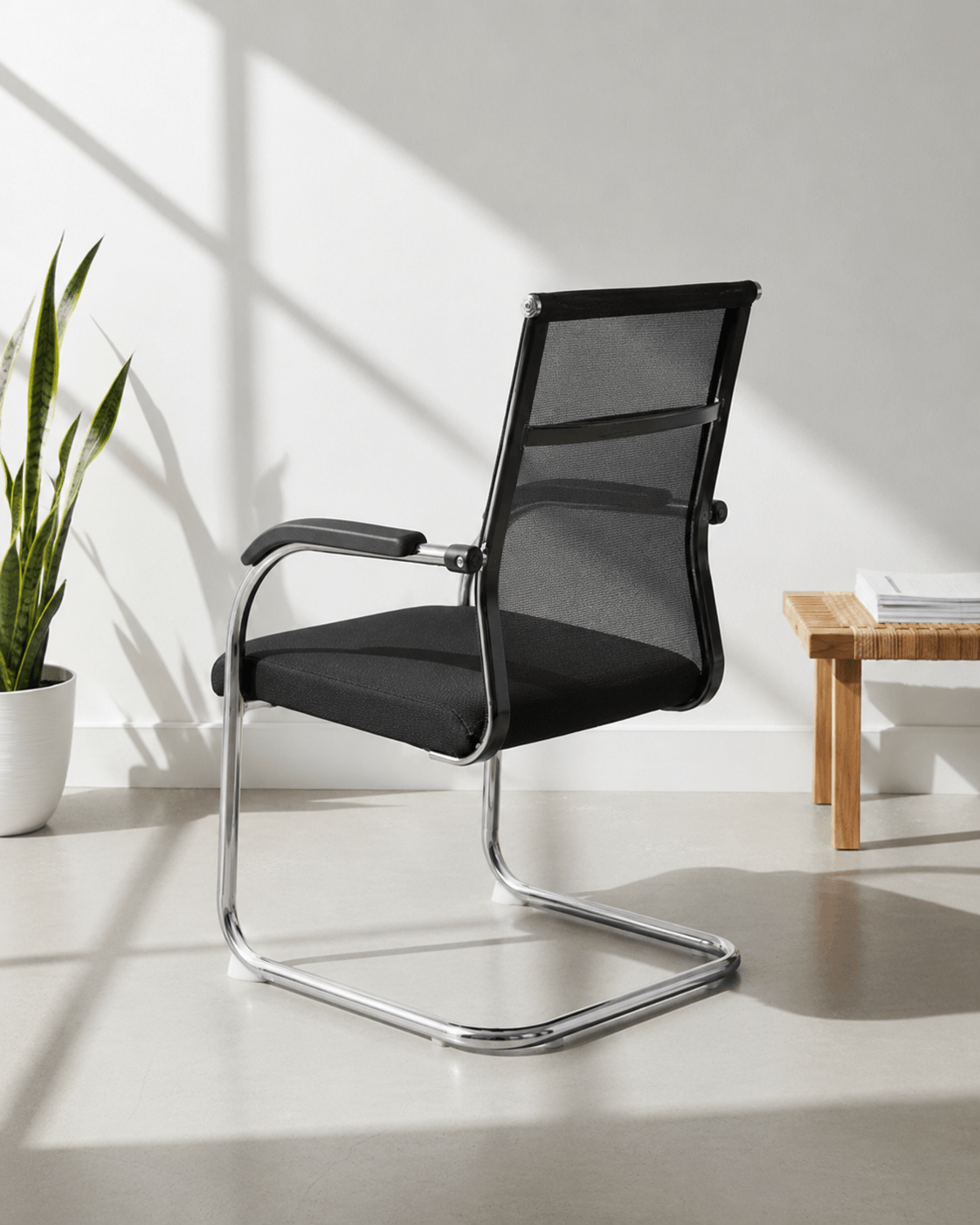 Rear view of SM 725 fixed visitor chair showing moulded foam back and chrome fixed base – Kazuri Store