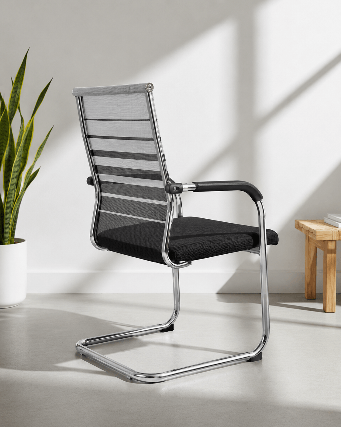 Rear view of SM 726 fixed visitor chair showing moulded foam back and chrome fixed base – Kazuri Store