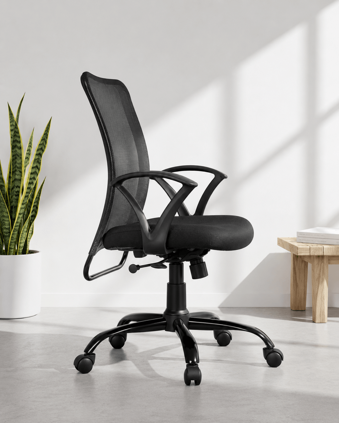 Side view of grey and black mid-back mesh revolving office chair with cushioned black seat, fixed loop armrests and MS black PC swivel base – Sigma MB by Kazuri