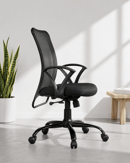 Side view of grey and black mid-back mesh revolving office chair with cushioned black seat, fixed loop armrests and MS black PC swivel base – Sigma MB by Kazuri