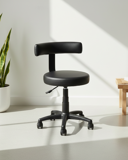 Front view of black cushioned revolving office stool with round seat, low backrest, armless design and MS black PC swivel base with castors – Sunny by Kazuri
