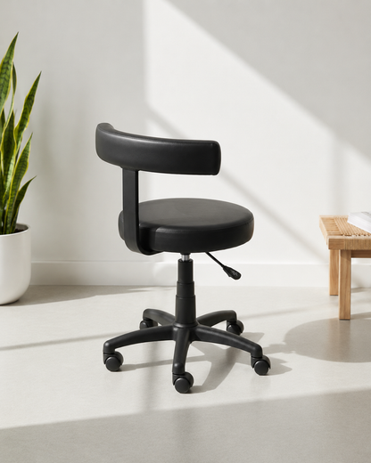 Side view of Sunny revolving office stool showing cushioned round seat, low backrest and MS black PC gas lift base – Kazuri Store