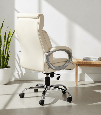 Back view of cream high-back executive cushioned revolving office chair with integrated headrest, padded armrests and chrome five-star swivel base – Tycoon by Kazuri