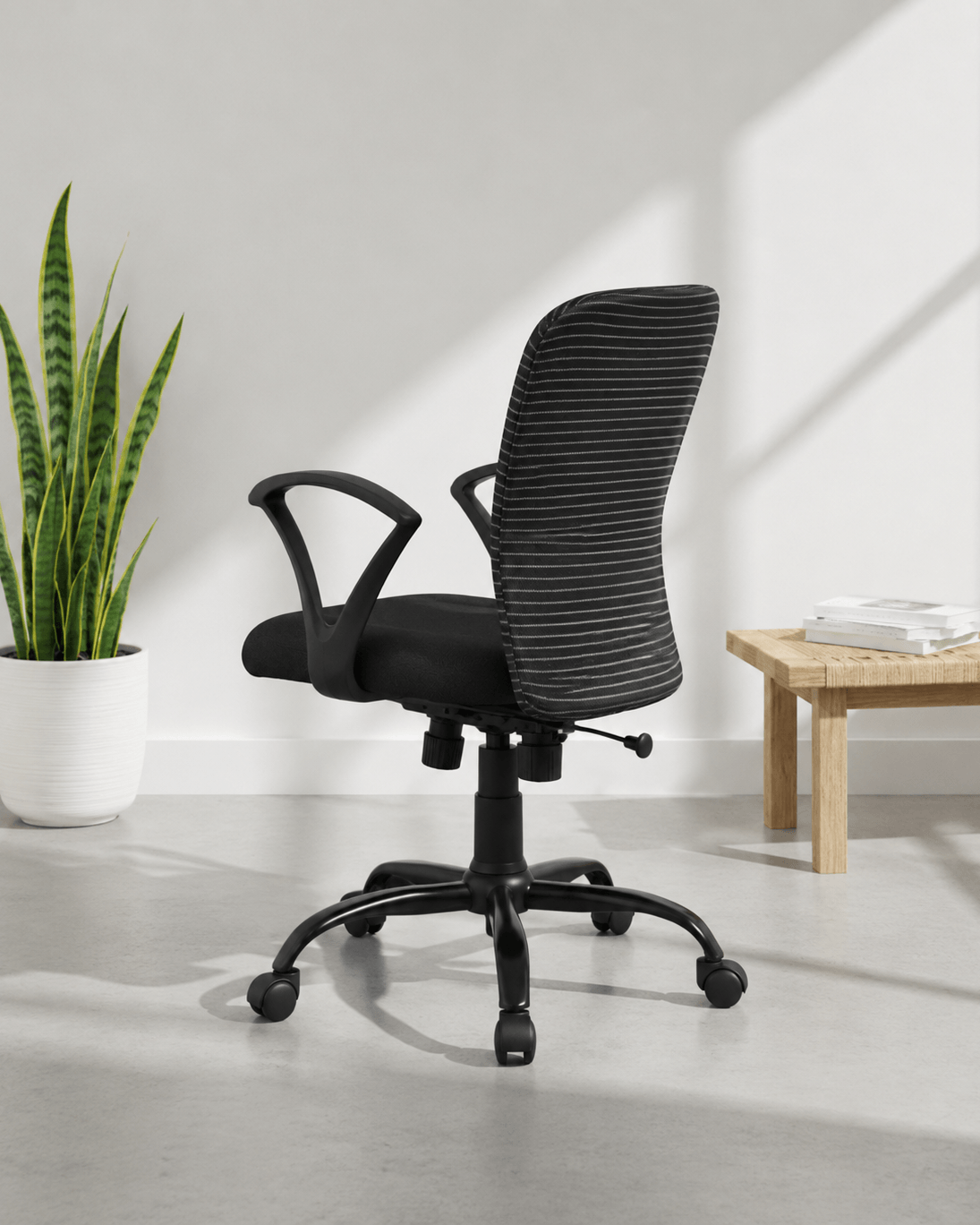 Rear view of Zebra MB mid-back fabric revolving office chair showing distinctive black and white horizontal stripe pattern and MS black PC five-star base – Kazuri Store