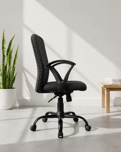 Side view of black and white striped mid-back fabric revolving office chair with fixed loop armrests and MS black PC swivel base – Zebra MB by Kazuri
