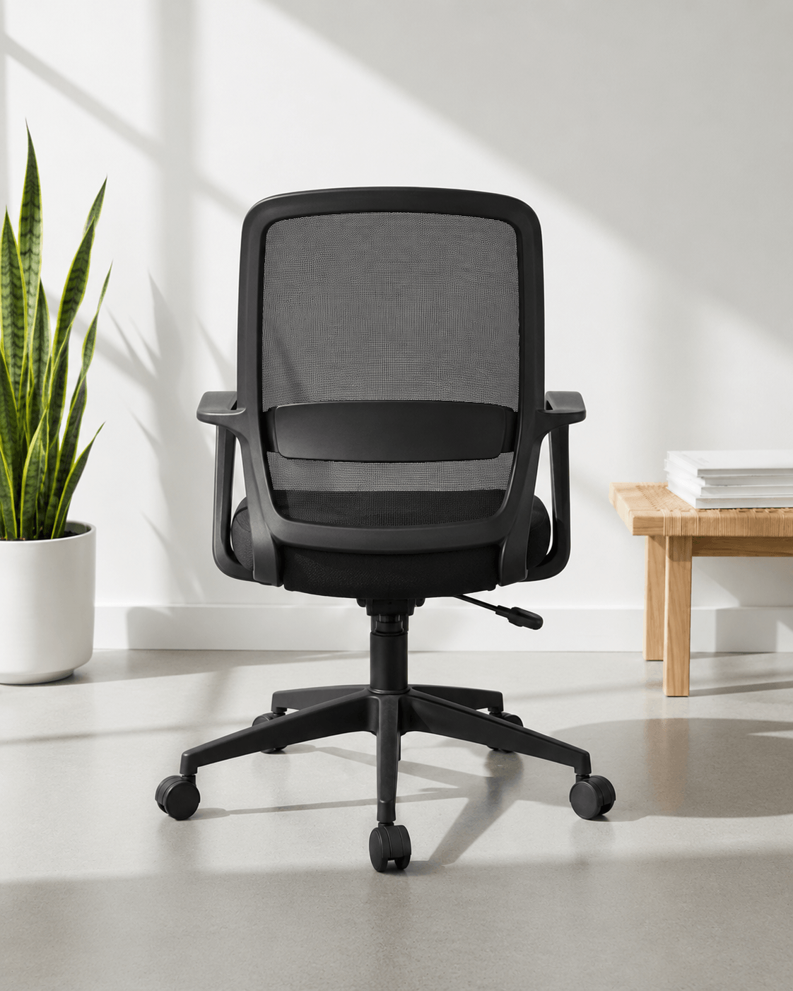 Rear view of Robo MB mid-back ergonomic office chair showing moulded foam back and nylon swivel base – Kazuri Store