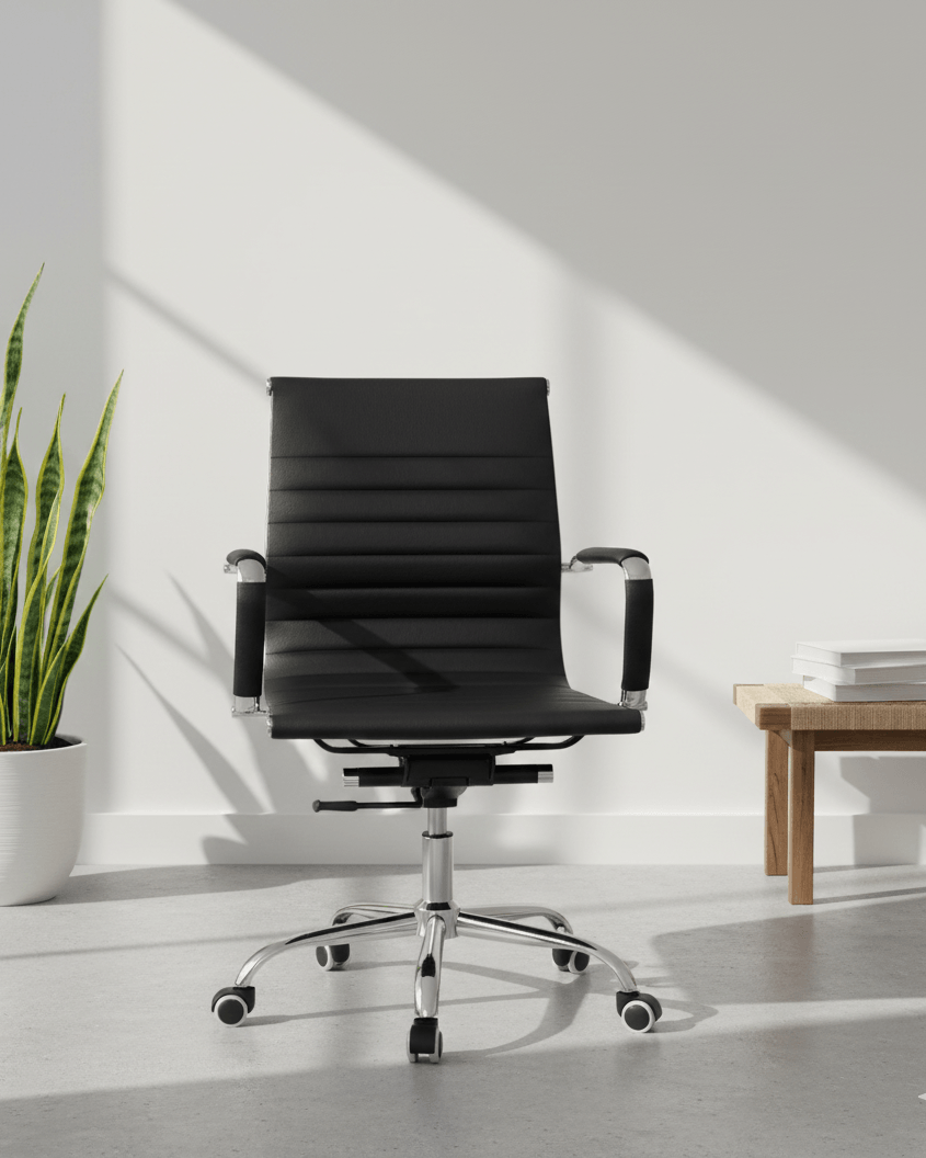 Front view of black mid-back executive cushioned revolving office chair with fixed armrests and premium chrome five-star base – Sleek MB by Kazuri